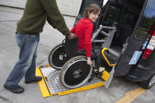 Man helping wheelchair user